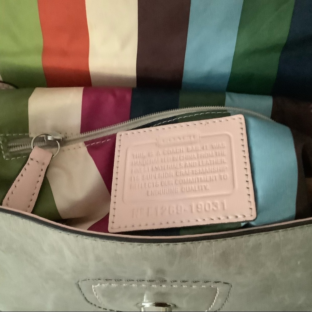 Light gray with pink piping authentic Coach handbag, May also be used crossbody